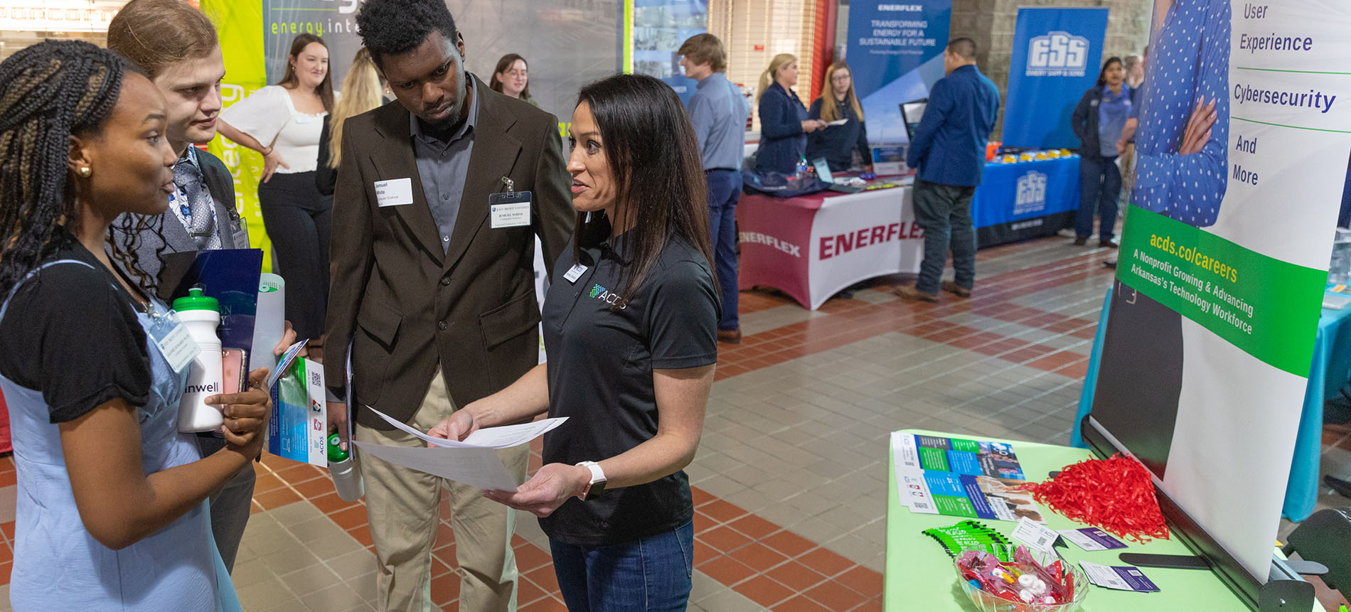 Arkansas STEM students and employers connecting at engineering career fair.