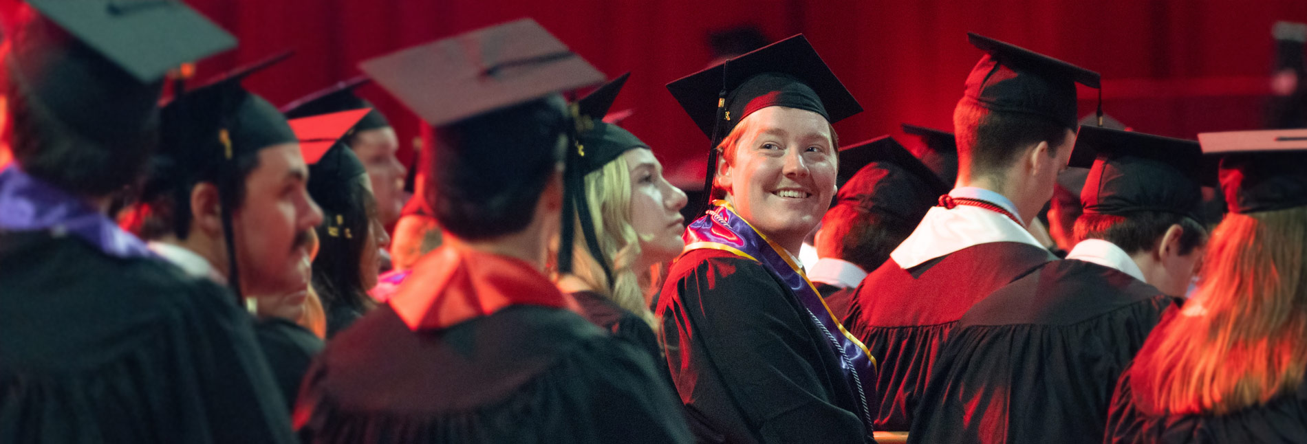 a group of students graduating at a commencement ceremony