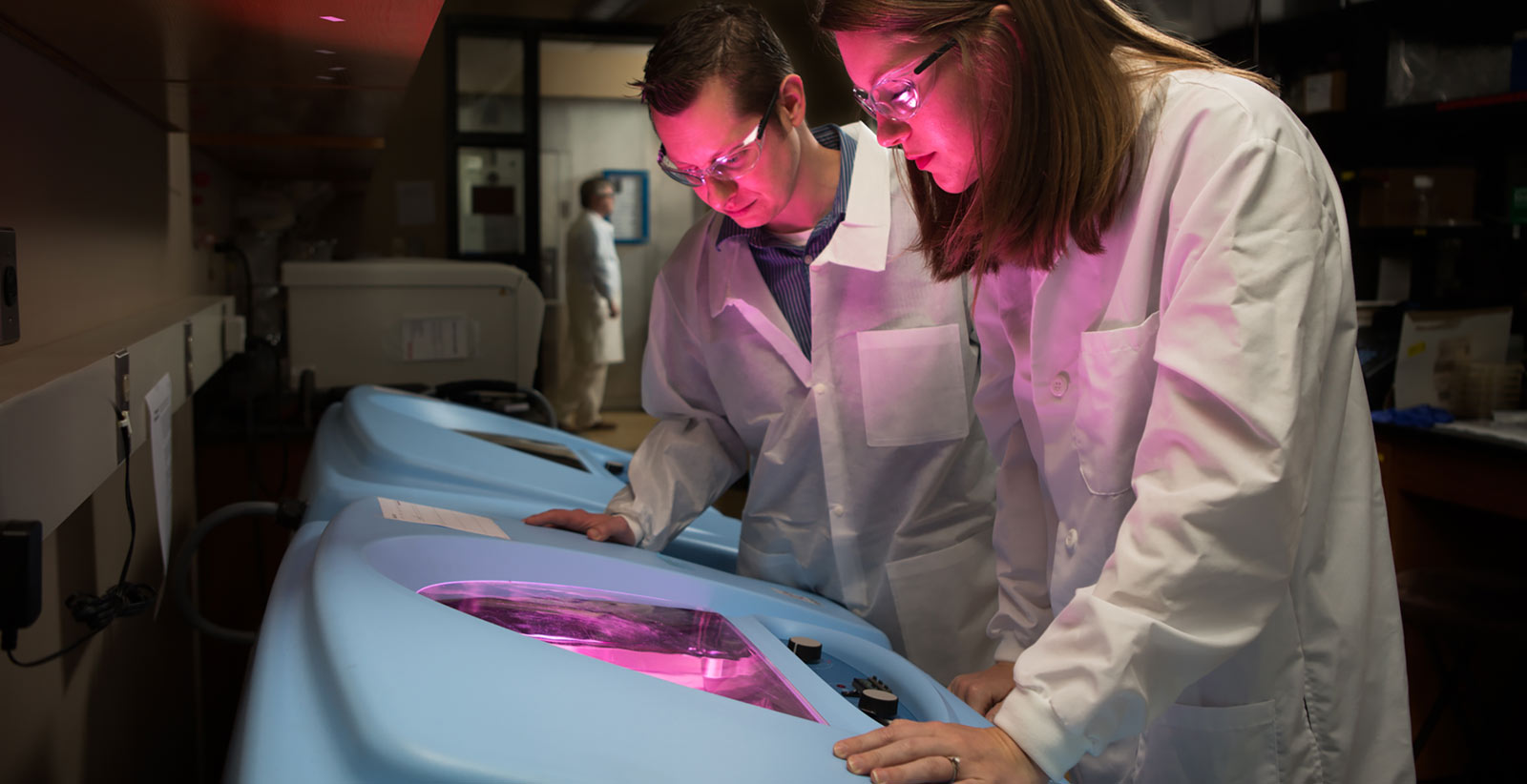 scientist examining research samples in advanced laboratory facility